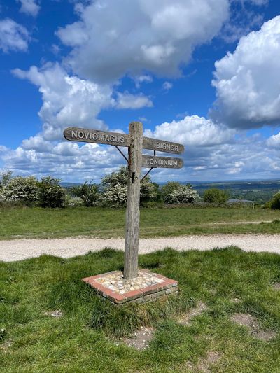 A sign at the car park for Bignor Hill points towards Bignor, Londinium (London) and Noviomagus (Chichester)