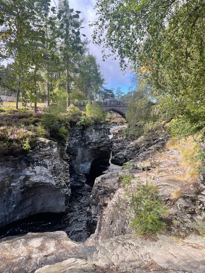 Take some time to admire the rushing River Dee squeezing through the gorge underneath the bridge